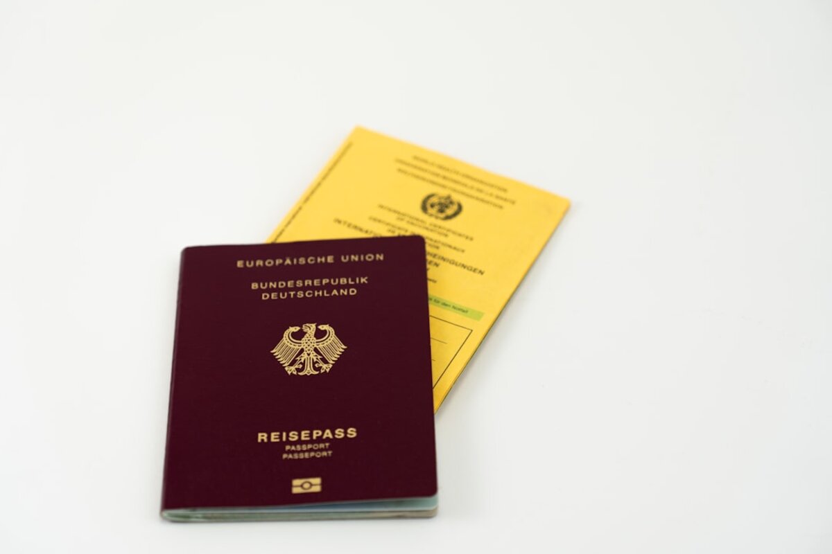NIE application documents and passport showing Spain immigration process